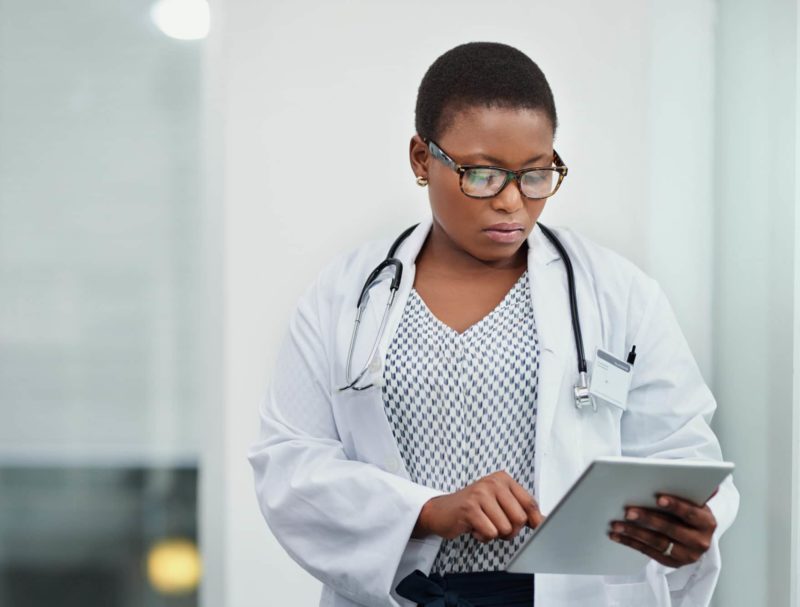 Doctor using a digital tablet in a hospital