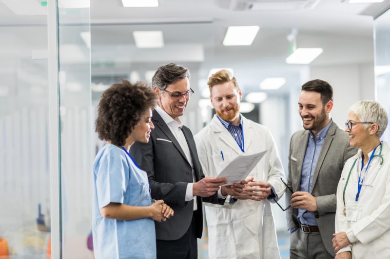 Doctors and businessmen meeting in hospital