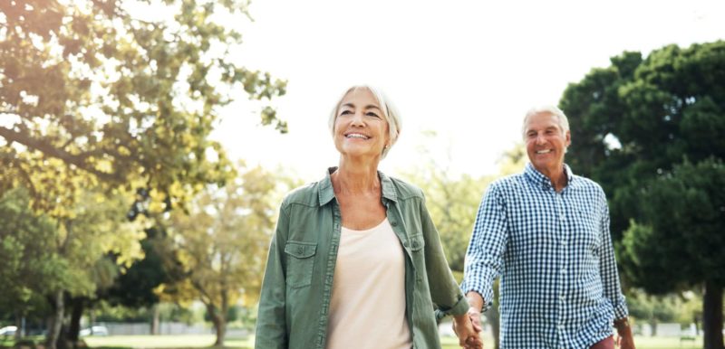 Senior couple walking in the park